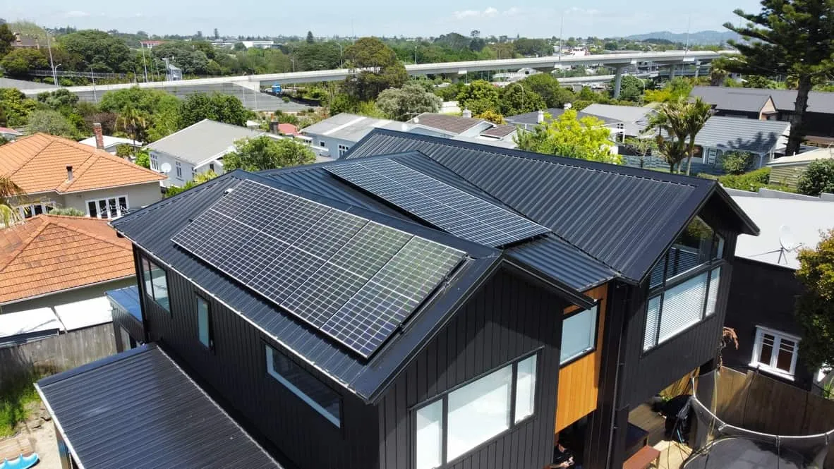 All-black solar panels fitted by Vital Energy on a black weatherboard home in Point Chevalier